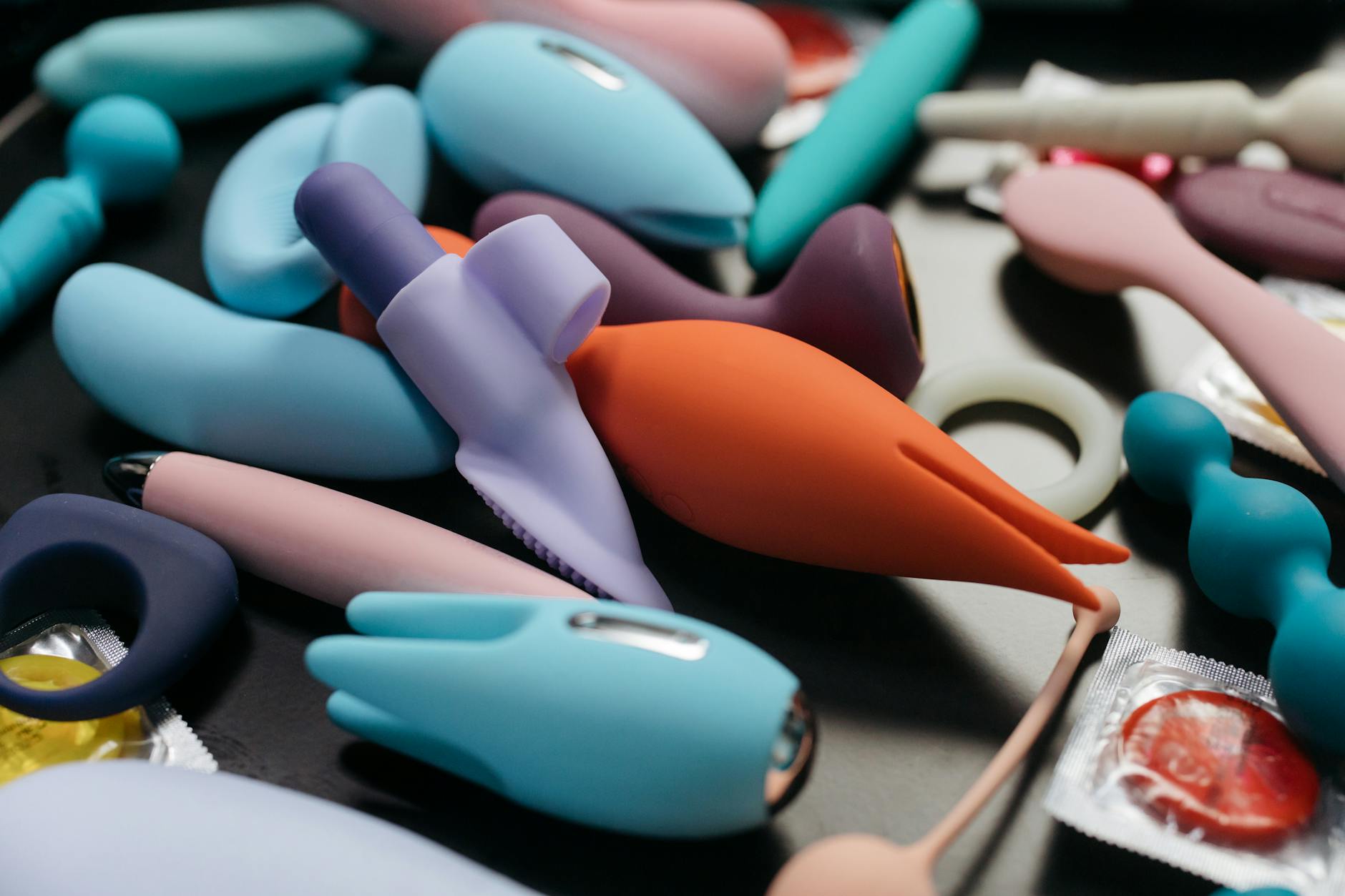 Close-up of hands holding a sleek vibrator together, showing intimate reconnection